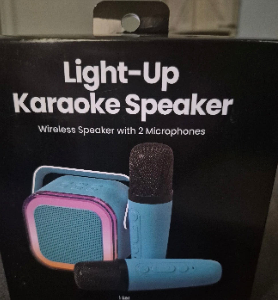 NEW - Light Up Karaoke Speaker. Comes with Two Microphones, USB charging cable.